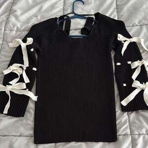 Black Ribbed lightweight Sweater Top with Creamy White Bow Accents.  Very Cute!!